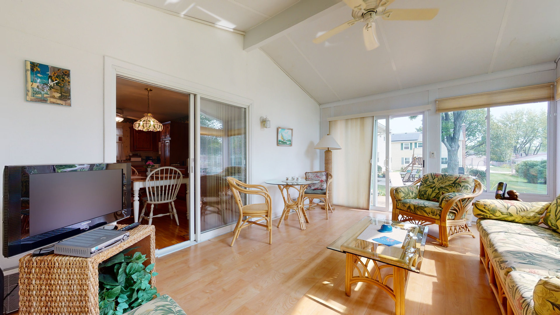 101 Stonegate Road Buffalo Grove, IL 60089 - Photo 10 of 18 a living room with furniture a dining table and a floor to ceiling window