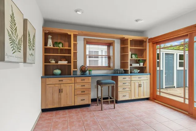 a kitchen with stainless steel appliances granite countertop a stove and cabinets