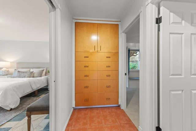 a view of bedroom with furniture and wooden floor