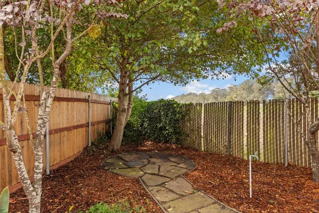 a backyard of a house with lots of green space