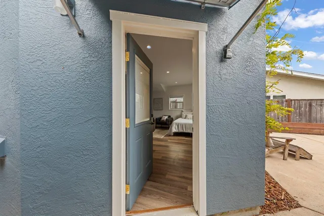 a spacious bedroom with a bed and a couch