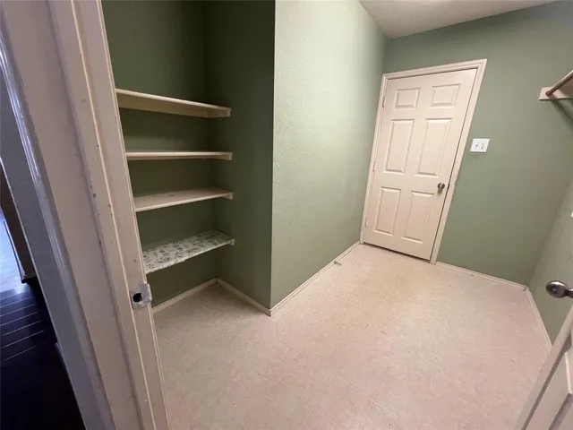 a view of a park with iron fence