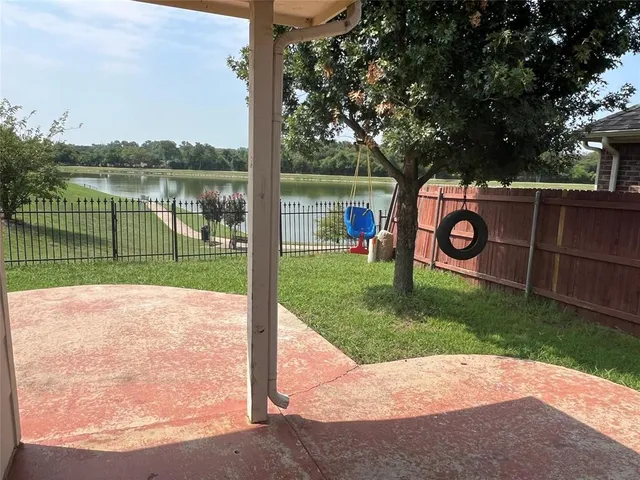 a view of a park with a lake view