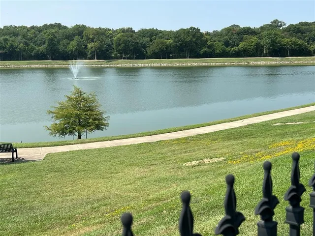 a view of a lake with a yard