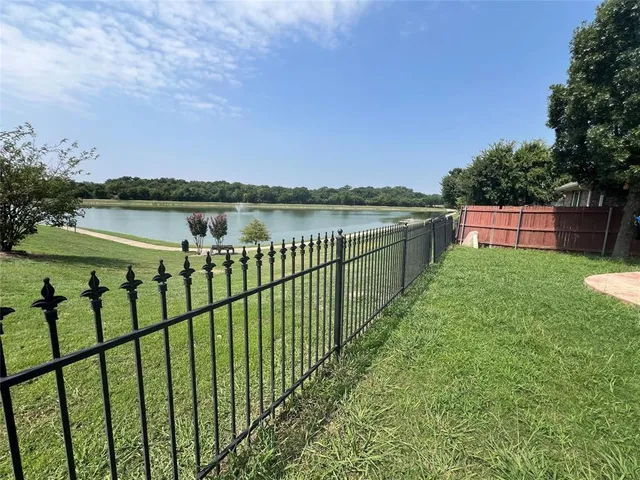 a view of a lake with a garden