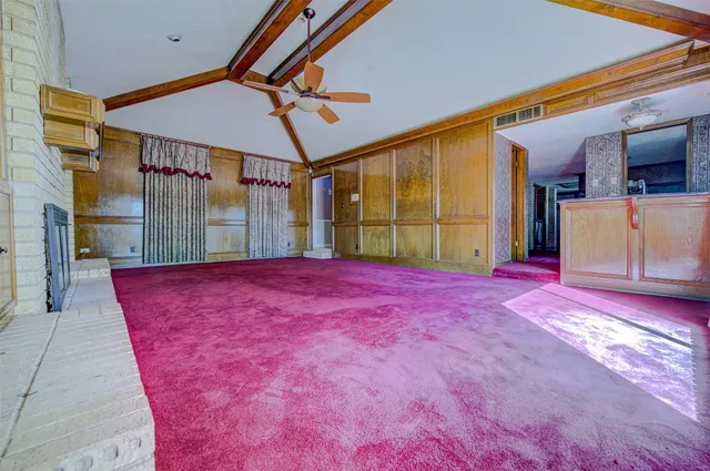 a bath room with a bed mirror and a table