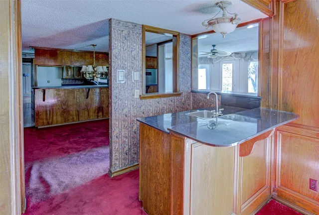 a bathroom with sink a mirror and vanity