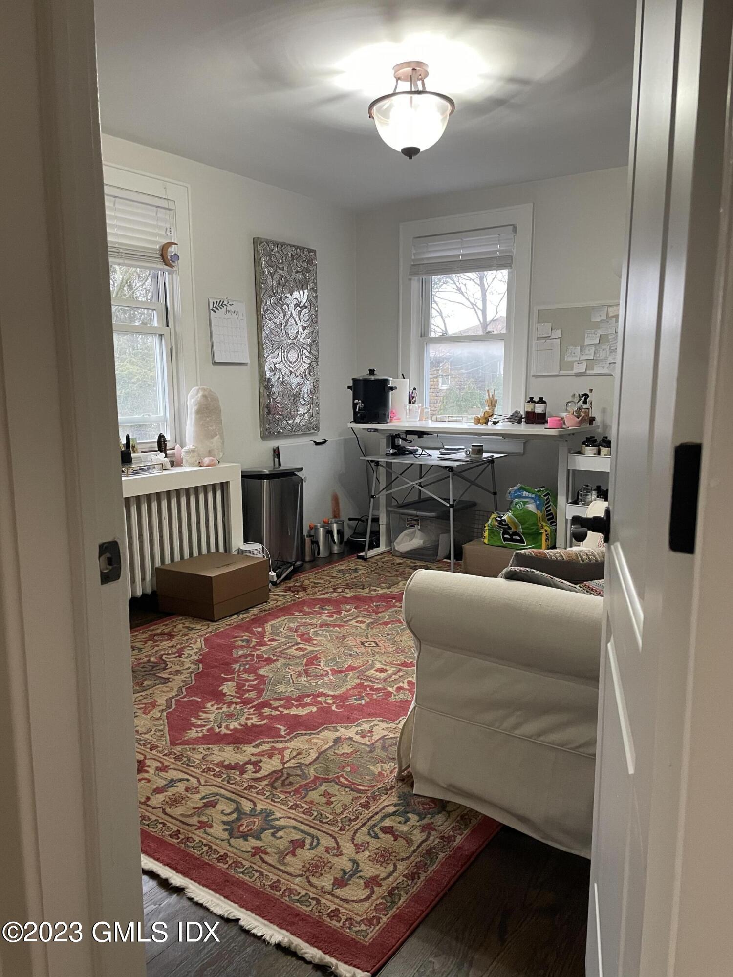 60 Weaver Street, Unit 2 Greenwich, CT 06831 - Photo 19 of 20 a bed room with furniture and a window