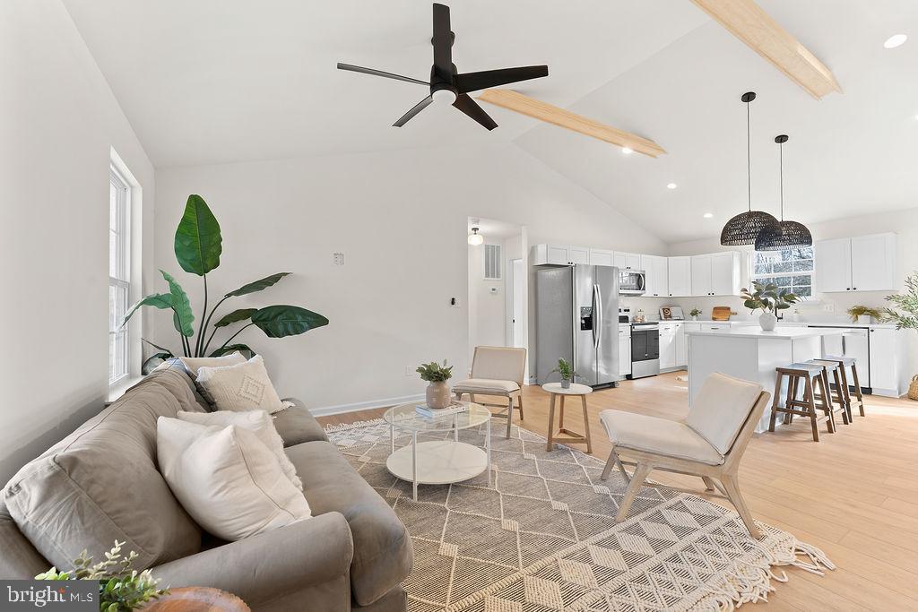 512 Cedar Hill Road Mineral, VA 23117 - Photo 3 of 53 a living room with furniture a rug and a chandelier