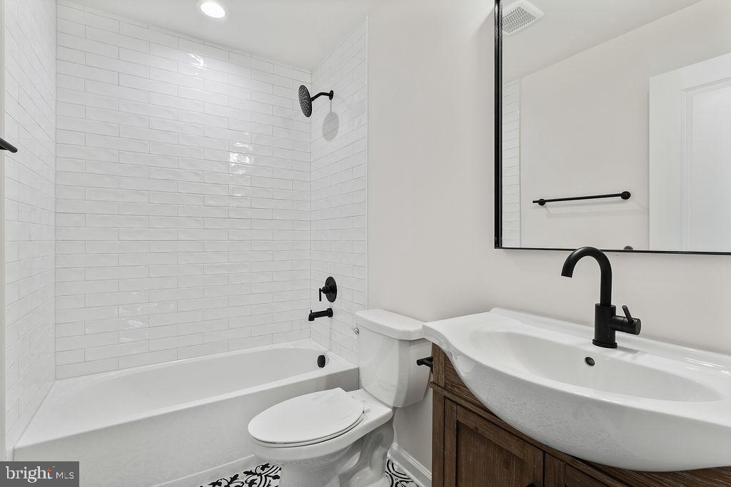512 Cedar Hill Road Mineral, VA 23117 - Photo 33 of 53 a bathroom with a sink toilet a mirror and shower