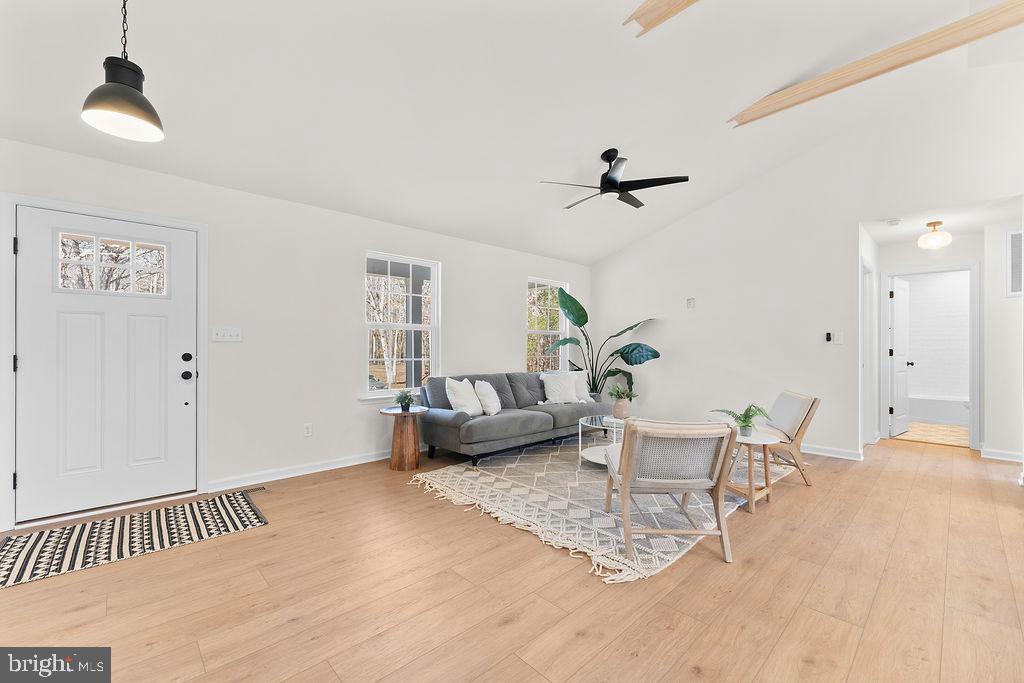 512 Cedar Hill Road Mineral, VA 23117 - Photo 5 of 53 a living room with furniture and a chandelier