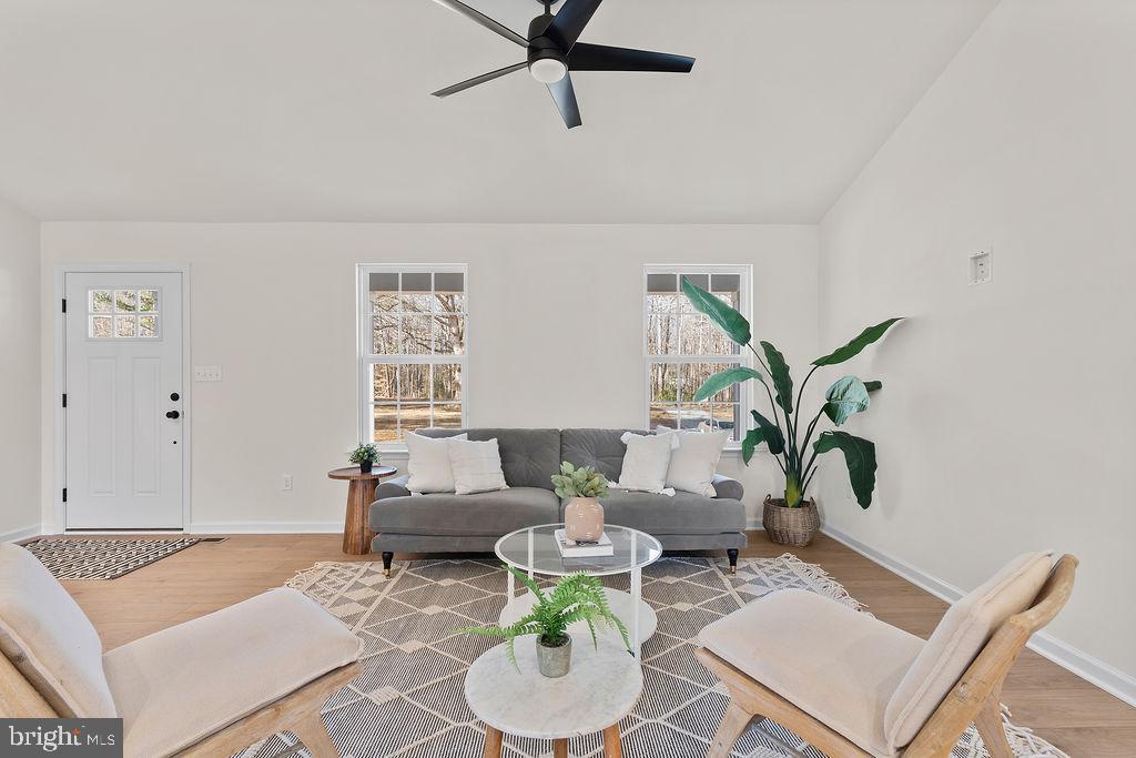 512 Cedar Hill Road Mineral, VA 23117 - Photo 7 of 53 a living room with furniture and a potted plant