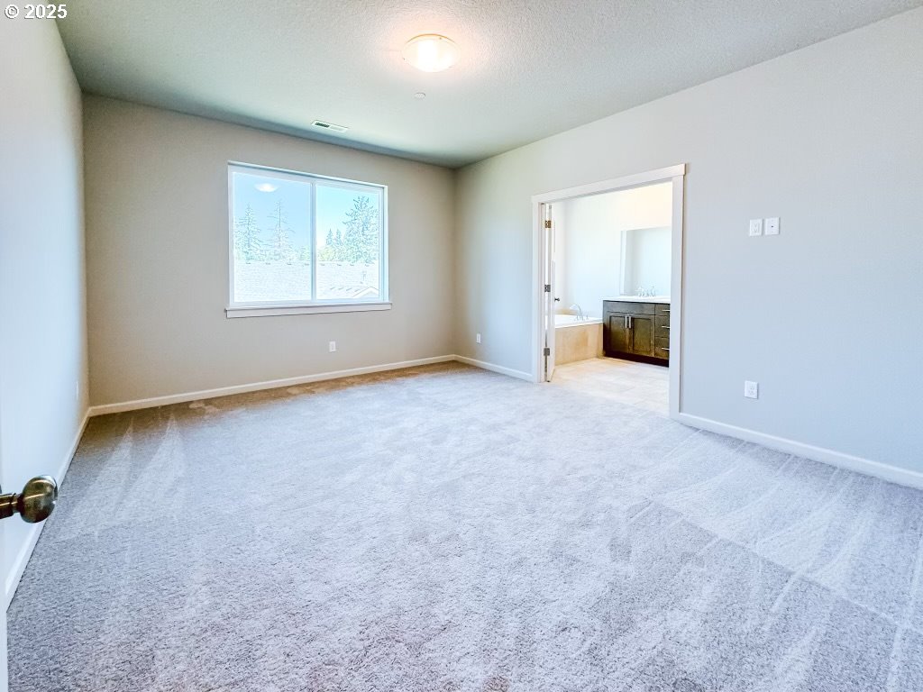 2630 South 4th Way Ridgefield, WA 98642 - Photo 19 of 32 an empty room with a empty space and windows