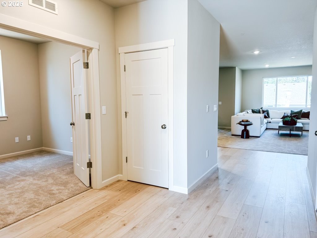 2630 South 4th Way Ridgefield, WA 98642 - Photo 4 of 32 a view of a livingroom with furniture and hardwood floor