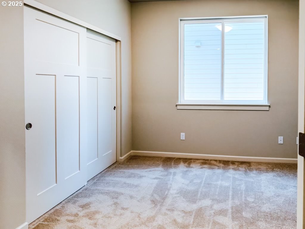 2630 South 4th Way Ridgefield, WA 98642 - Photo 7 of 32 a view of an empty room with a window
