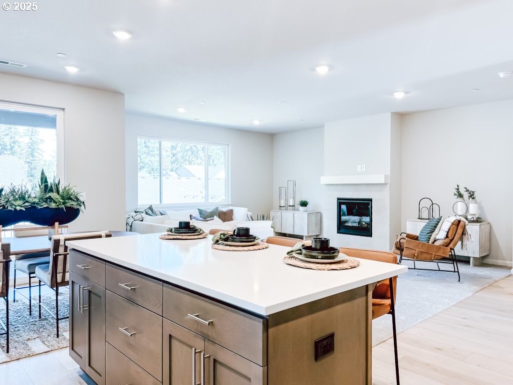 2630 South 4th Way Ridgefield, WA 98642 - Photo 10 of 32 a kitchen with a stove a sink and a living room view