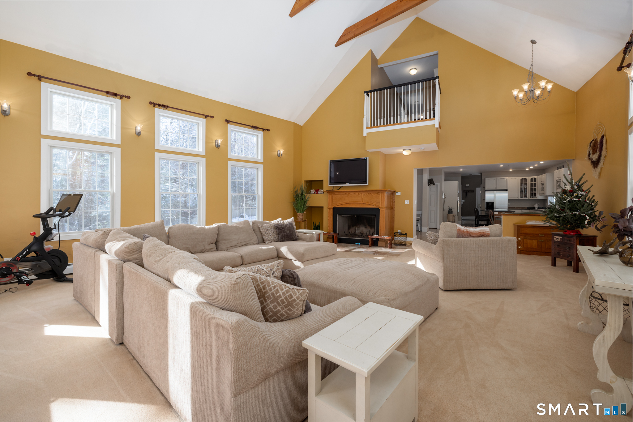 40 Warner Road Barkhamsted, CT 06063 - Photo 18 of 35 a living room with furniture a fireplace and a floor to ceiling window