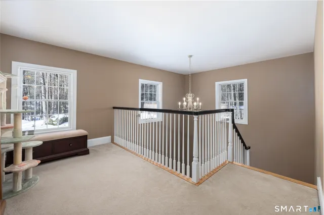 a view of a livingroom with furniture and windows