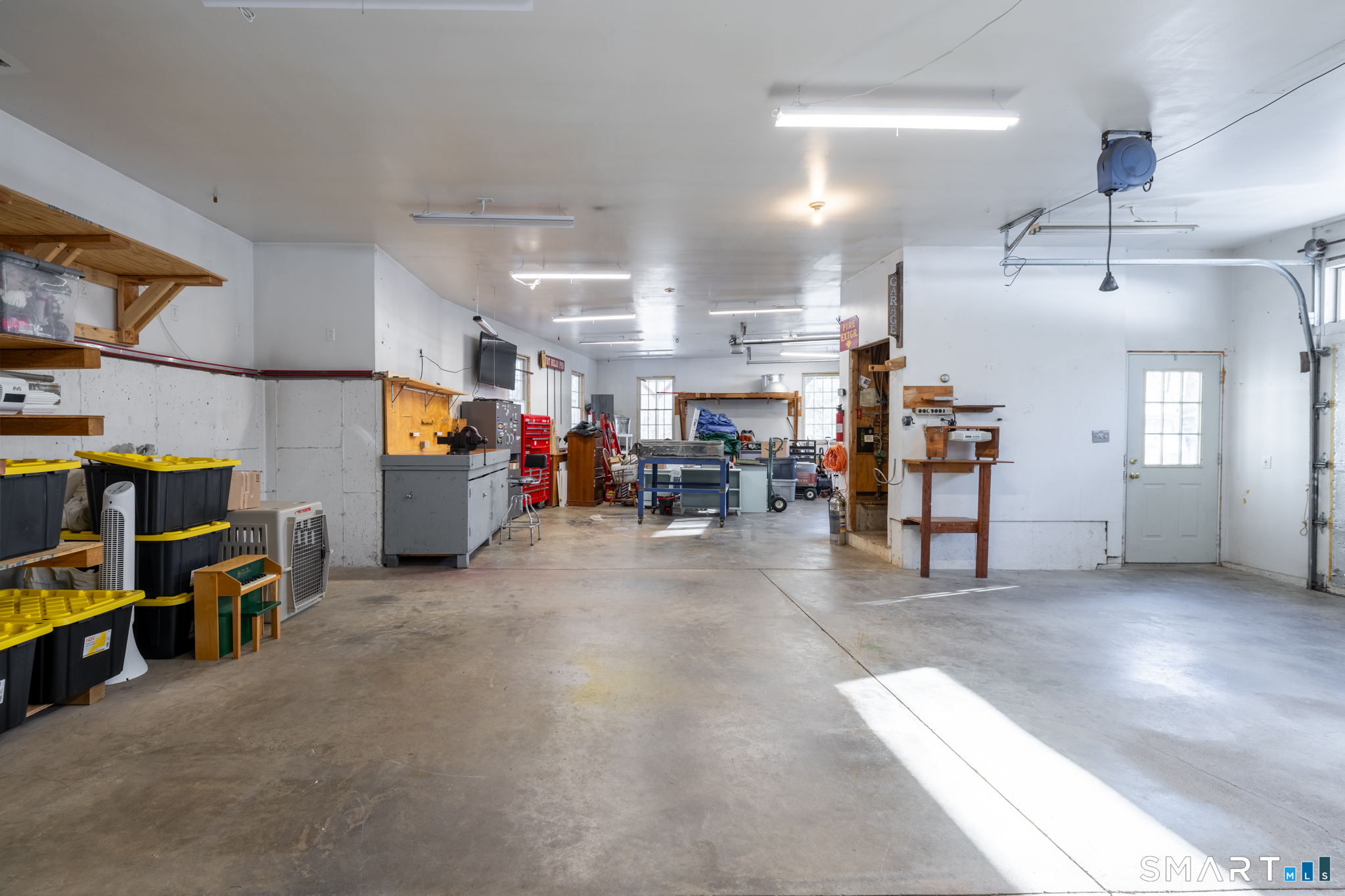 40 Warner Road Barkhamsted, CT 06063 - Photo 32 of 35 a living room with lots of furniture and a flat screen tv