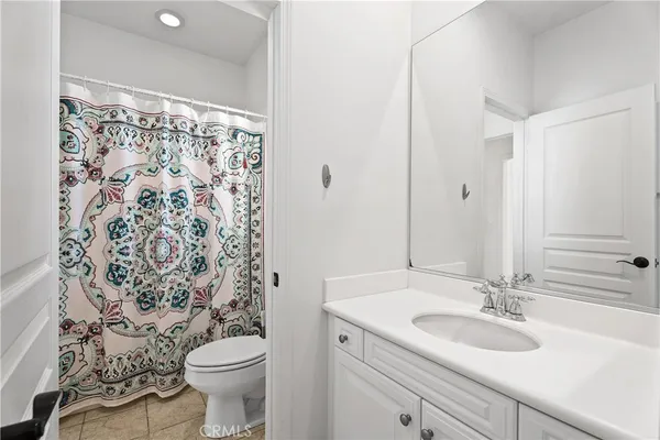 a view of a swimming pool with a garden and seating area