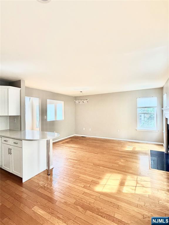 35 Harrier Court, Unit 35 Wayne, NJ 07470 - Photo 6 of 16 a view of a kitchen with wooden floor and a kitchen