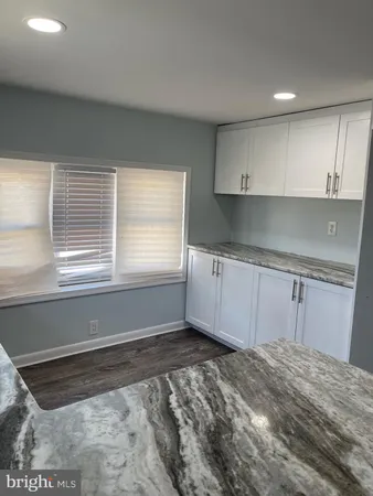 a view of a kitchen with a sink cabinets and a window