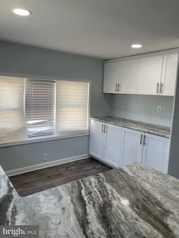 a view of a kitchen with a sink cabinets and a window