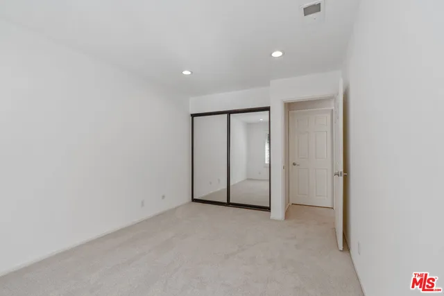a view of a chair and table in backyard