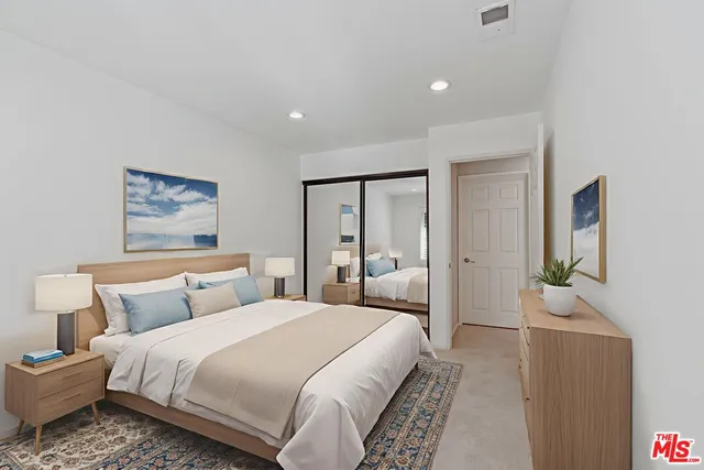 a view of a patio with table and chairs and potted plants