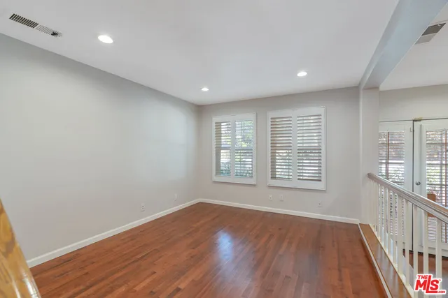 a front view of a house with lots of yellow lighting