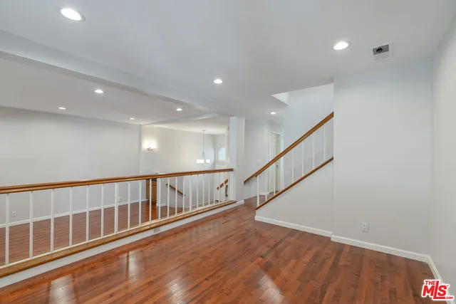 front view of a house with a tree