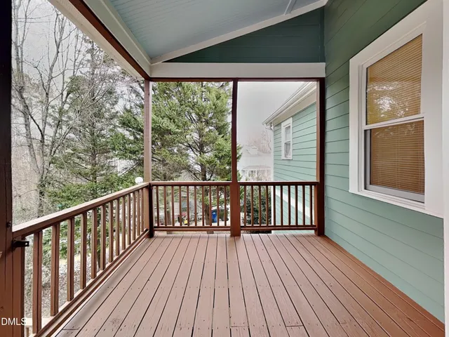 a view of balcony with wooden floor