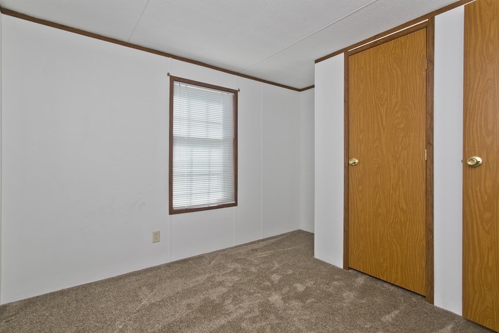 62 Holiday Circle Chicopee, MA 01020 - Photo 11 of 17 a view of an empty room with a window