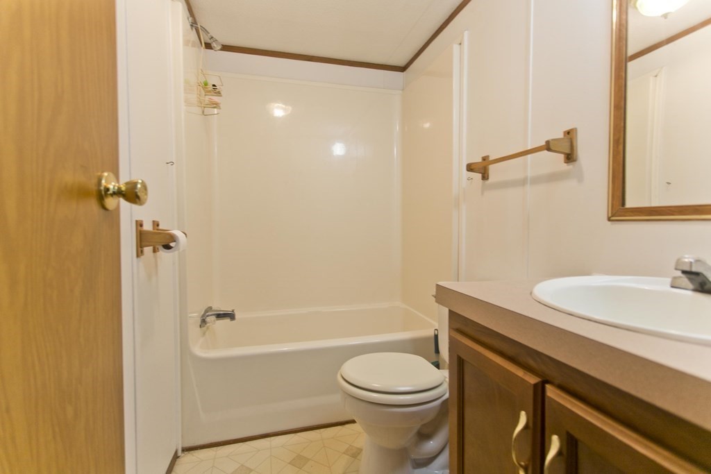 62 Holiday Circle Chicopee, MA 01020 - Photo 12 of 17 a bathroom with a sink a toilet and shower