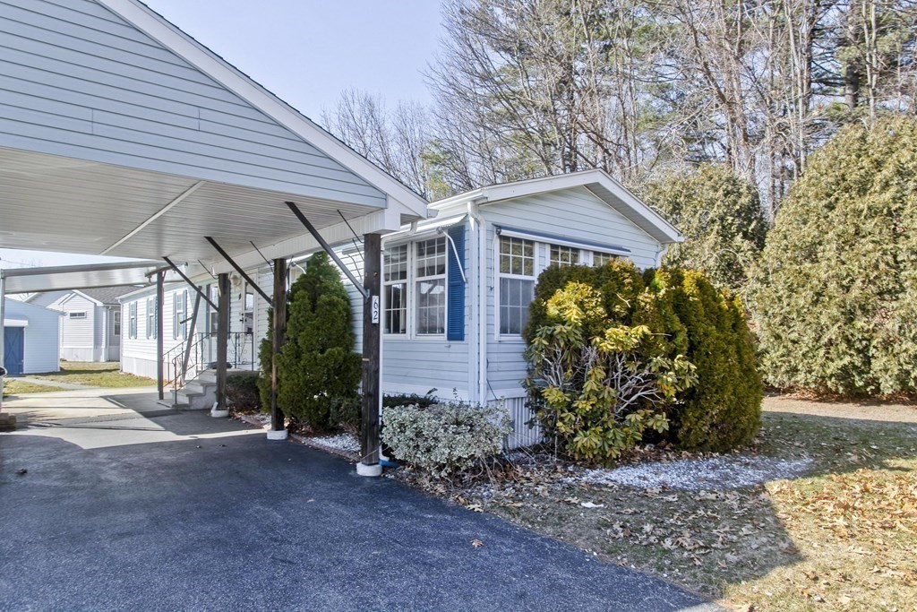 62 Holiday Circle Chicopee, MA 01020 - Photo 2 of 17 a view of a big house with plants and large trees