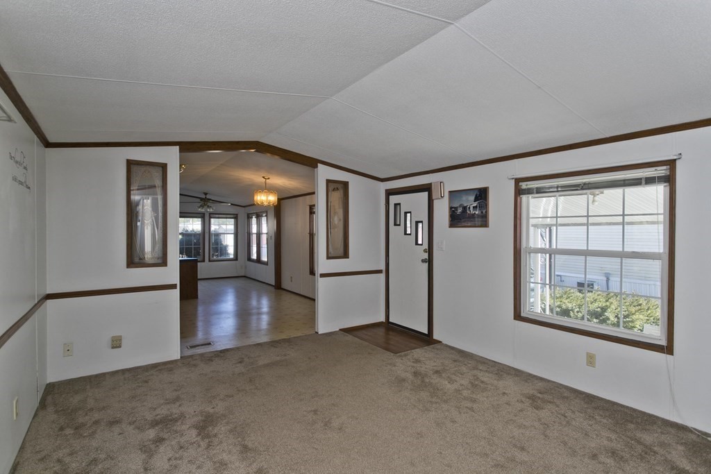 62 Holiday Circle Chicopee, MA 01020 - Photo 6 of 17 a view of livingroom with hardwood floor and hallway