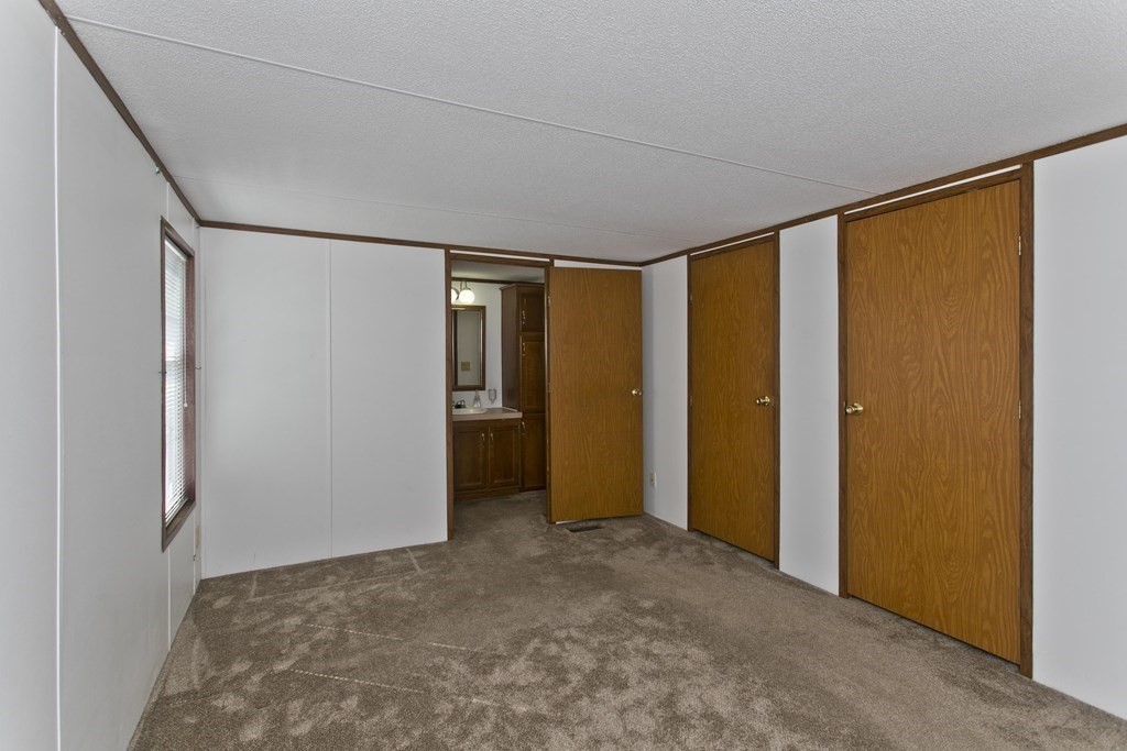 62 Holiday Circle Chicopee, MA 01020 - Photo 8 of 17 a view of empty room with floor to ceiling window