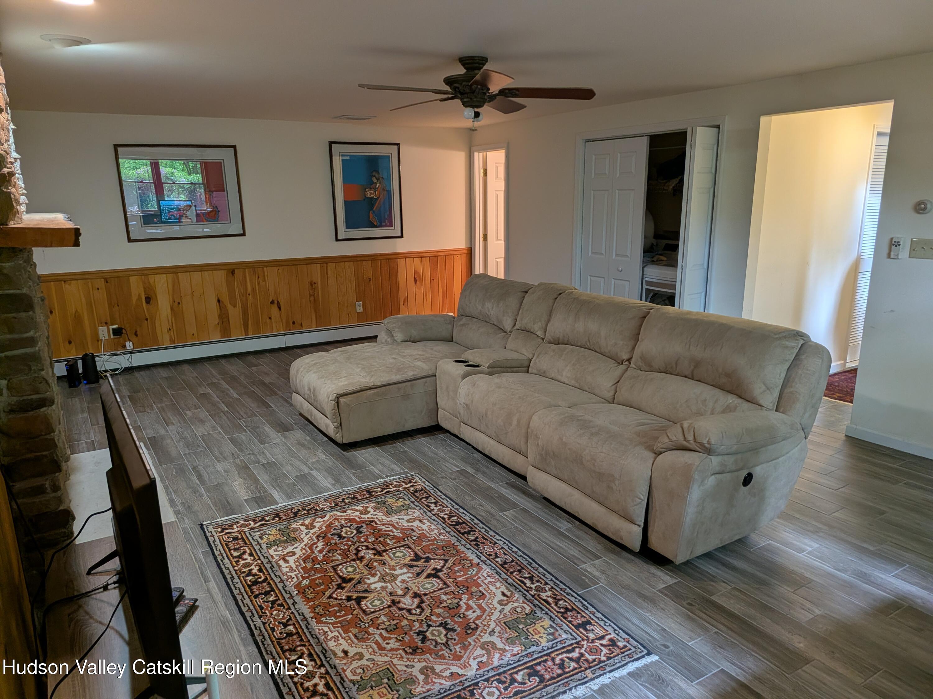 513 South Mountain Road Gardiner, NY 12525 - Photo 27 of 63 a living room with furniture and a rug