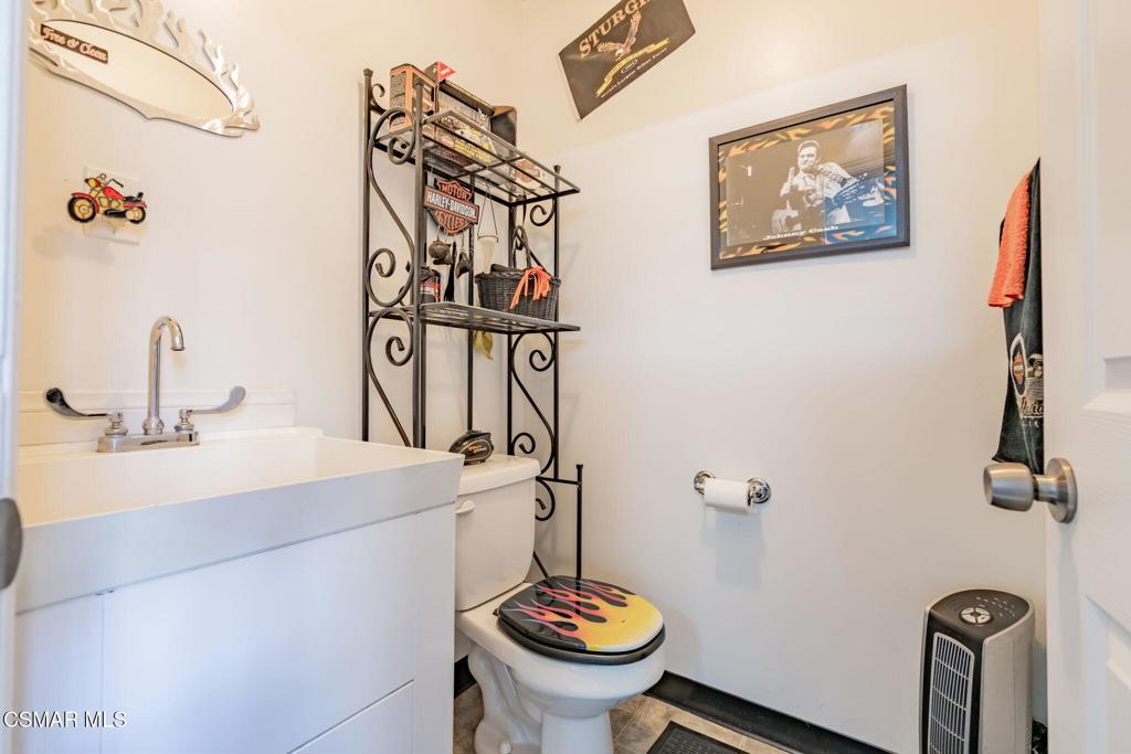 6078 Peppertree Lane Simi Valley, CA 93063 - Photo 48 of 59 a bathroom with a sink mirror and toilet