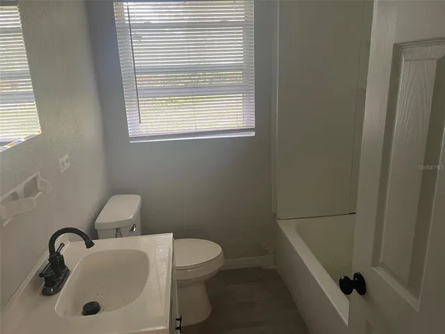a bathroom with a sink and a toilet