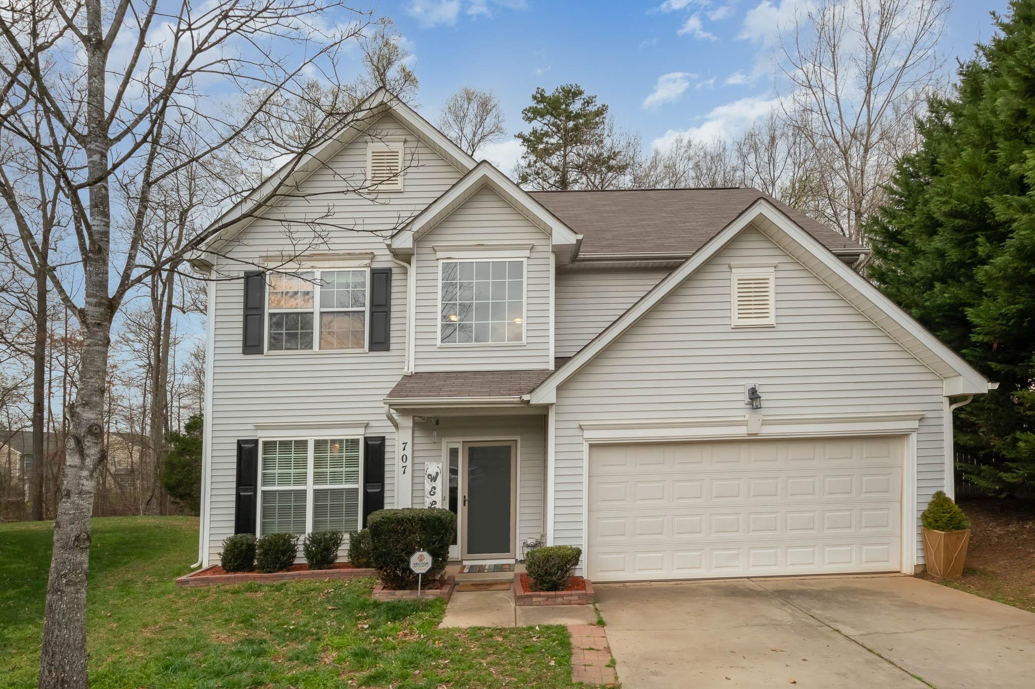 707 Harrier Road Charlotte, NC 28216 - Photo 1 of 29 a front view of a house with garden