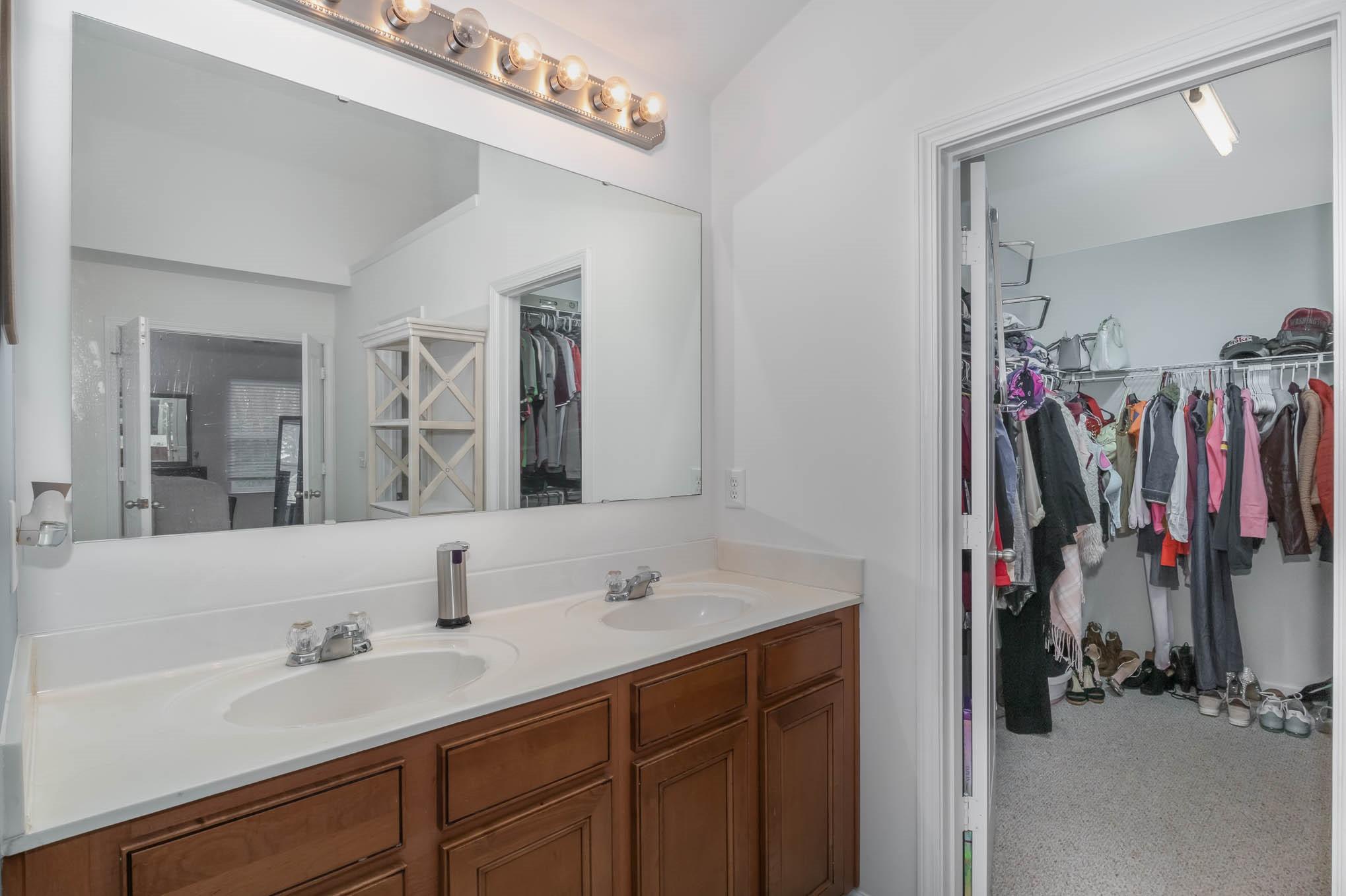 707 Harrier Road Charlotte, NC 28216 - Photo 18 of 29 a bathroom with a sink and a mirror