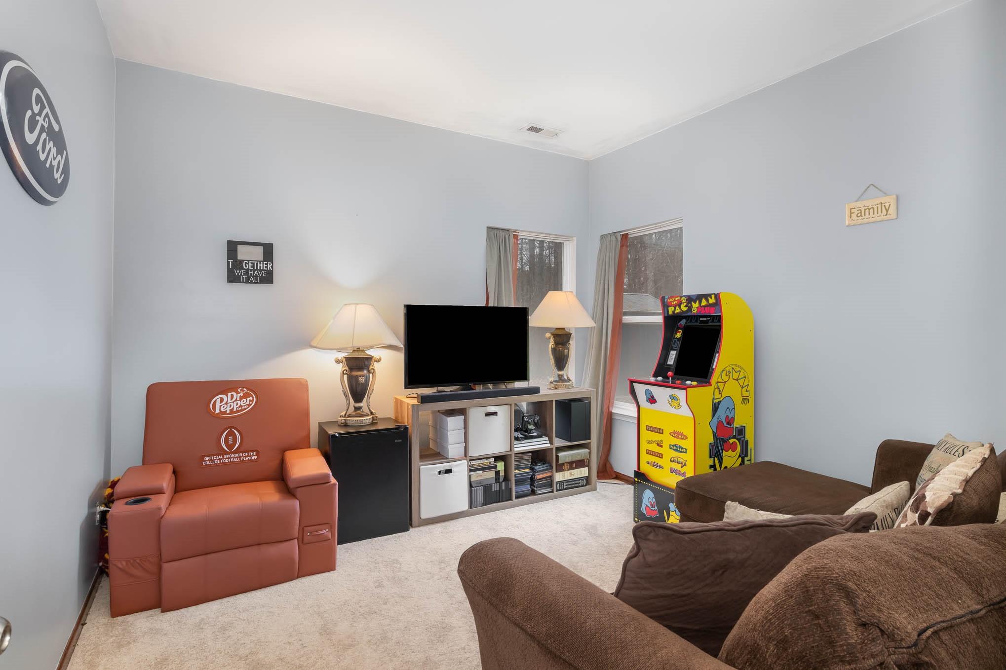 707 Harrier Road Charlotte, NC 28216 - Photo 24 of 29 a living room with furniture and a flat screen tv