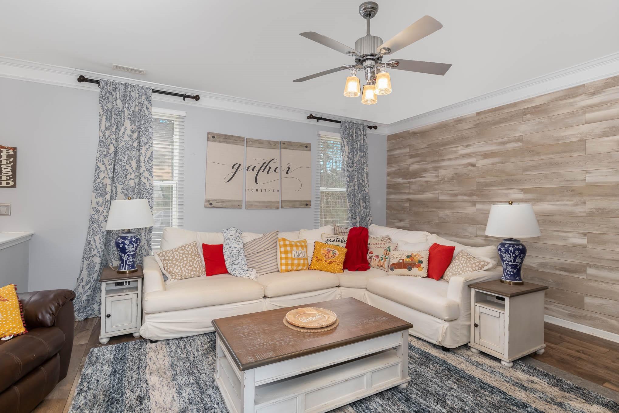 707 Harrier Road Charlotte, NC 28216 - Photo 5 of 29 a living room with furniture and a rug