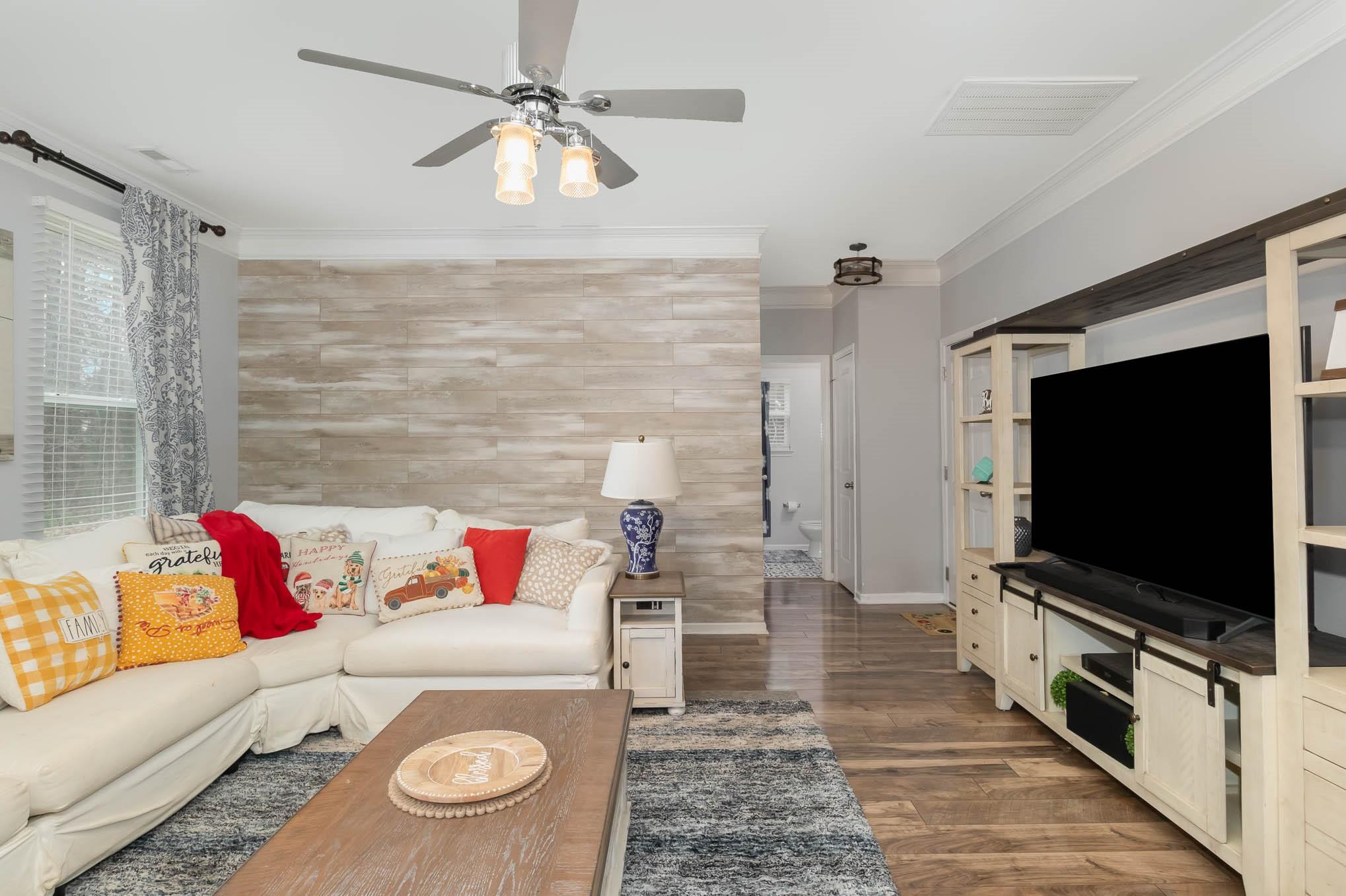 707 Harrier Road Charlotte, NC 28216 - Photo 6 of 29 a living room with furniture and a flat screen tv