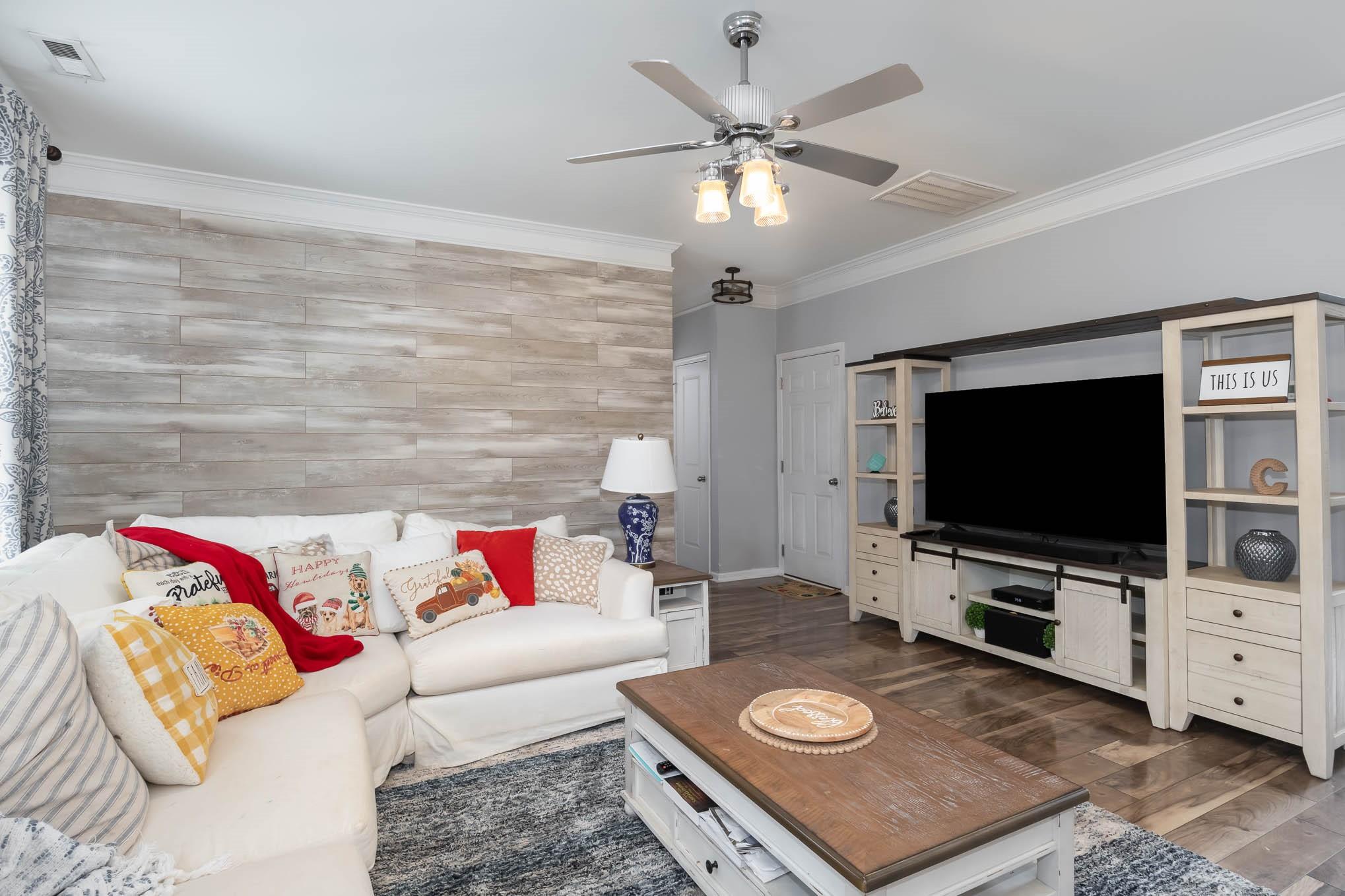 707 Harrier Road Charlotte, NC 28216 - Photo 7 of 29 a living room with furniture and a flat screen tv