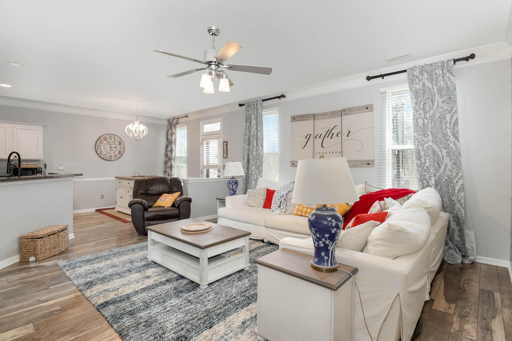 707 Harrier Road Charlotte, NC 28216 - Photo 8 of 29 a living room with furniture and a chandelier