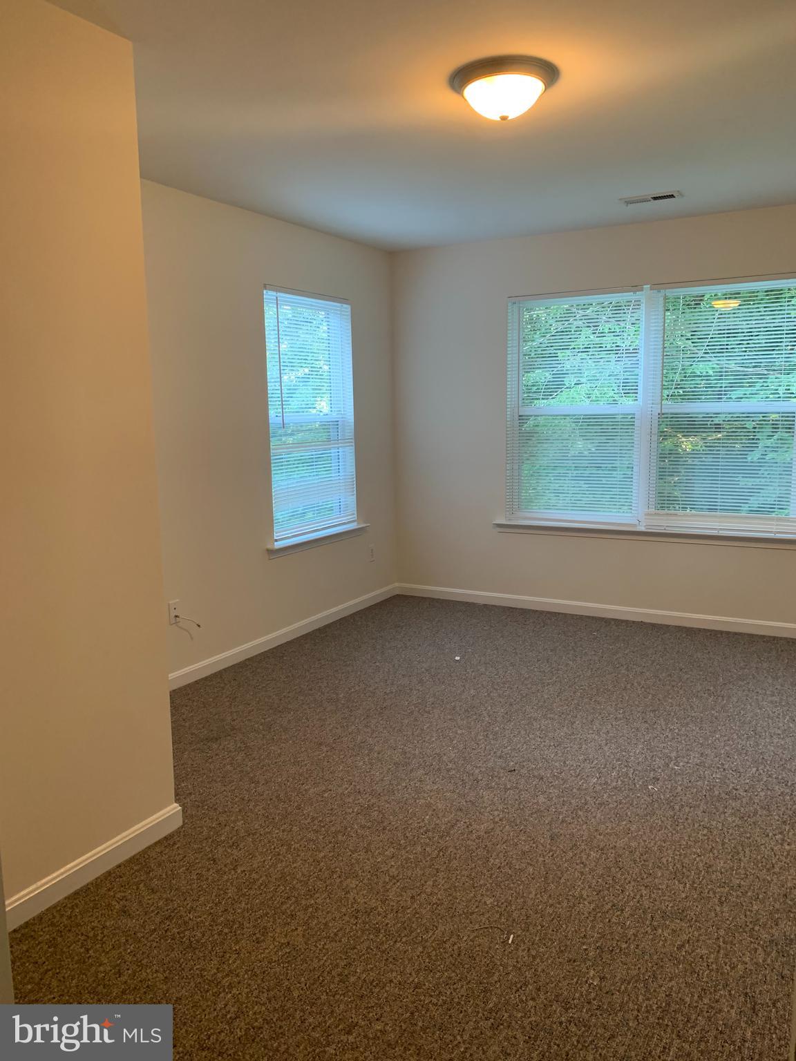 5061 Bayside Road Chesapeake Beach, MD 20732 - Photo 6 of 15 an empty room with a window