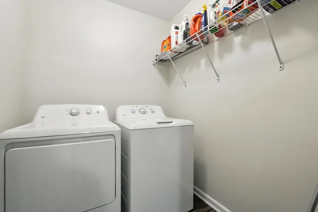 a bedroom with a bed and a chair