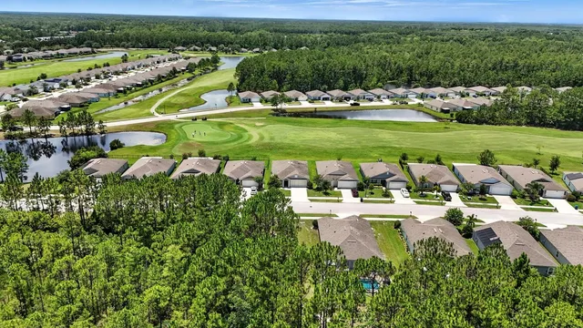 an aerial view of a house with a garden
